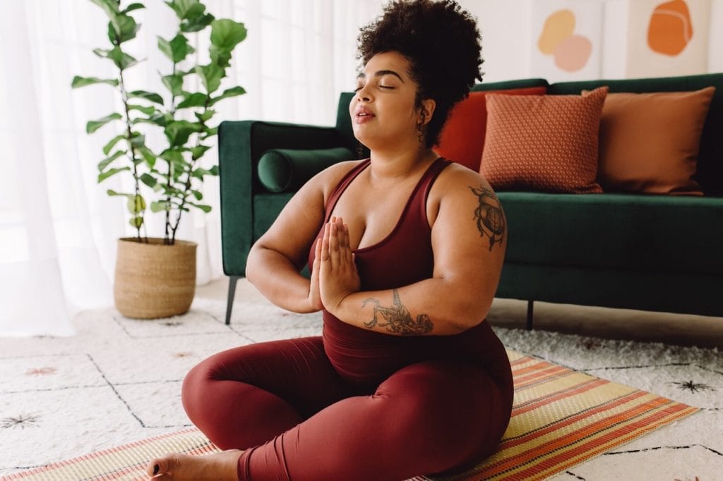 Woman practicing meditation and deep breathing techniques
